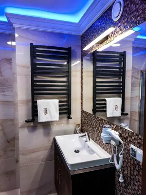 a bathroom with a sink and a mirror at Beskidia - Noclegi w Beskidach in Roczyny
