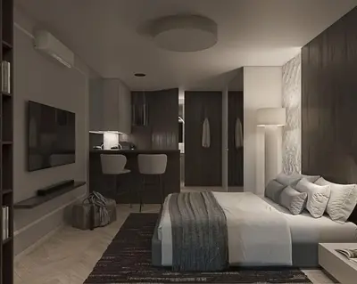 a bedroom with a king sized bed and a kitchen at Prestiżowy apartament A free parking in Kraków