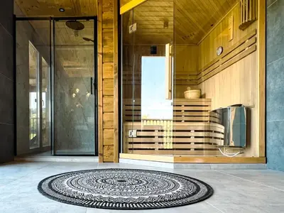 a room with a mandala rug on the floor of a house at Kowalowa Chata Zawoja in Zawoja