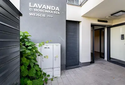 a building with two refrigerators outside of a building at Gusta Cosy Apartment by BookingHost in Kraków