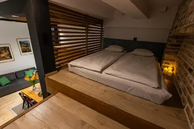 a bedroom with a bed in a room at Vintage Bracka 6 Apartment in Kraków