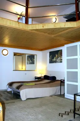 a bedroom with a large bed in a room at Apartment San Sebastian, City Center in Kraków