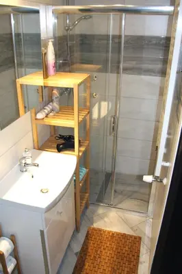 a bathroom with a shower and a sink at Apartment San Sebastian, City Center in Kraków