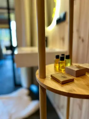 a wooden table with a box on top of it at Brown Deer - z Sauną na Tarasie, Jacuzzi i Widokiem na Góry - by Deer Hills Luxury Apartments in Kocoń