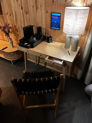 a desk with a computer and a lamp and a chair at Brown Deer - z Sauną na Tarasie, Jacuzzi i Widokiem na Góry - by Deer Hills Luxury Apartments in Kocoń