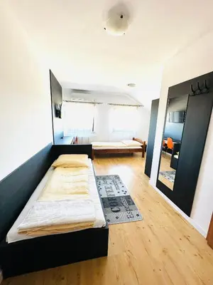 a bedroom with a bed in a room at Agawa restauracja&Hotel in Dębno
