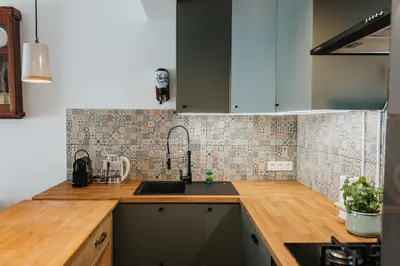 a kitchen with a sink and a counter top at ICE next to the Wawel Castle Free Parking Two Cars in Kraków