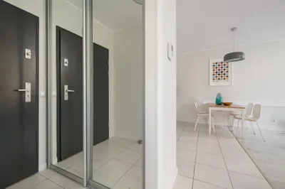 a glass door in a room with a table at Apartment with Terrace - Wawrzyńca 21 Street in Kraków