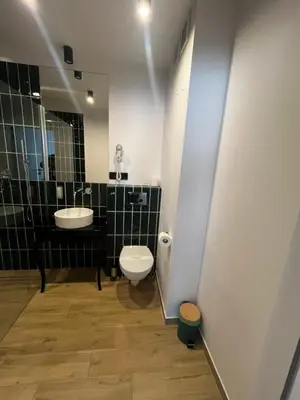 a bathroom with a toilet and a sink at Sweet Dreams Apartments Kazimierz in Kraków