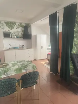 a living room with a bed and a kitchen at Apartament Solny Wieliczka Centrum 3 in Wieliczka