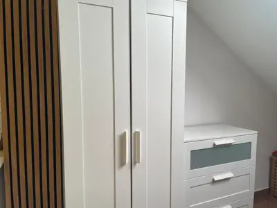 a white cabinet in a room with a drawer at Apartament Solny Wieliczka Centrum 3 in Wieliczka