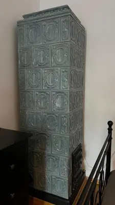 a green dresser in a room with a staircase at P&J Apartments Koletek in Kraków