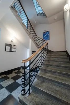 a staircase in a building with a stair case at Horizon Apartments - Luxury Studio, Old Town in Kraków