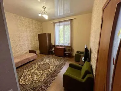 a living room with a couch and chairs and a window at Vacation House of Tadeusz in Oświęcim