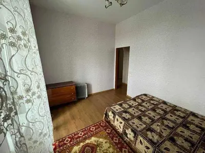 a bedroom with a bed and a dresser in a room at Vacation House of Tadeusz in Oświęcim