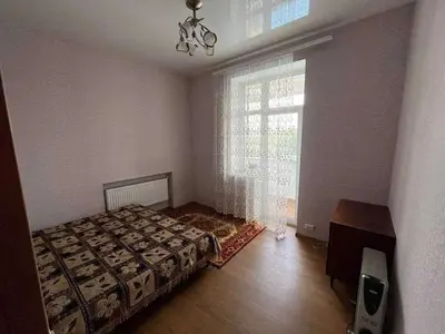 a bedroom with a bed and a window at Vacation House of Tadeusz in Oświęcim
