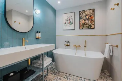 a bathroom with a shower and a toilet at Hotel Indigo Krakow - Wawel Castle by IHG in Kraków