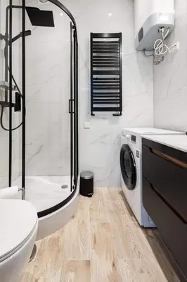 a bathroom with a shower sink and a toilet at Malila Premium Apartaments Cracow City Center Rtm Zbigniewa Dunin Wąsowicza 3 in Kraków