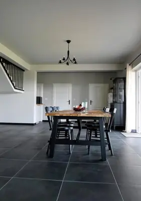 a dining room with a wooden table and chairs at Siedlisko na Agatowej w Rudnie in Rudno