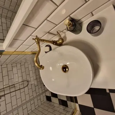 a bathroom with a white sink in a room at Siedlisko na Agatowej w Rudnie in Rudno