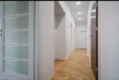an empty hallway with white walls and wooden floors at Malila Premium Apartments Cracow City Rtm Zbigniewa Dunin Wąsowicza 4 in Kraków