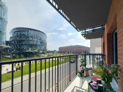 a balcony with a view of a building at Klimeckiego Luxury Apartments 189 in Kraków