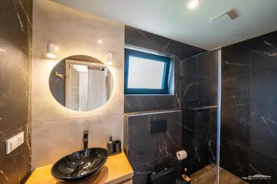 a bathroom with a sink and a mirror at Mucharskie Zacisze in Zagórze