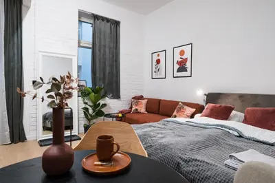 a living room with a bed and a couch at D21 Art Vintage Old Town in Kraków