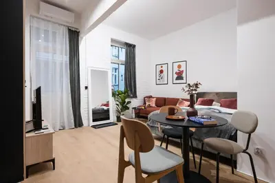 a living room with a table and a couch at D21 Art Vintage Old Town in Kraków