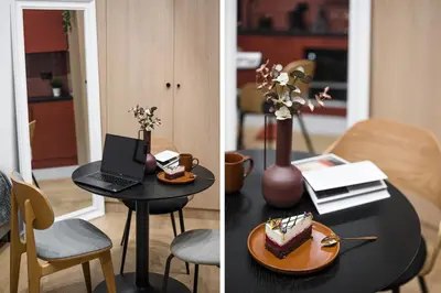 a table with a plate of cake and a laptop at D21 Art Vintage Old Town in Kraków