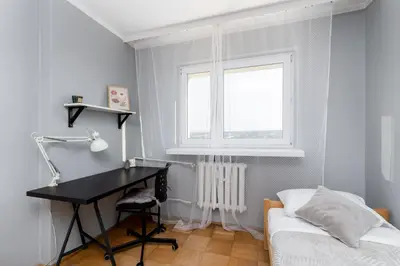 a bedroom with a desk and a bed and a window at Park Zakrzówek Spacious Apartment by BookingHost in Kraków