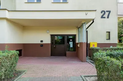 a building with a door with the number on it at Park Zakrzówek Spacious Apartment by BookingHost in Kraków