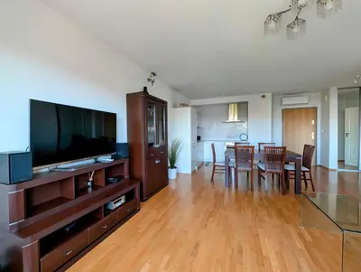 a living room with a dining table and a flat screen tv at Masarska 9 by Homeprime in Kraków