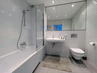 a bathroom with a shower and a toilet and a sink at Masarska 9 by Homeprime in Kraków