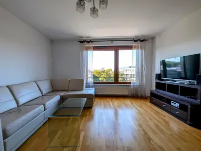 a living room with a couch and a flat screen tv at Masarska 9 by Homeprime in Kraków