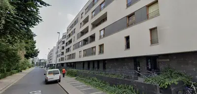 a car driving down a street next to a building at Masarska 9 by Homeprime in Kraków