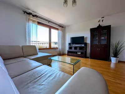 a living room with a couch and a tv at Masarska 9 by Homeprime in Kraków