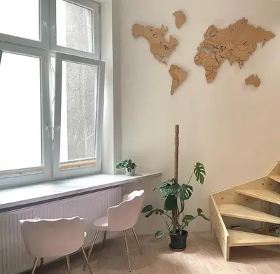 a room with two chairs and a map on the wall at Nowoczesny Apartament w Centrum Krakowa in Kraków