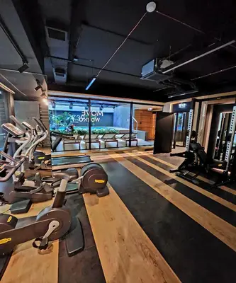 a gym with several treadmills and a fish tank at Your time in Heart of Cracow , Gym & free parking in Kraków