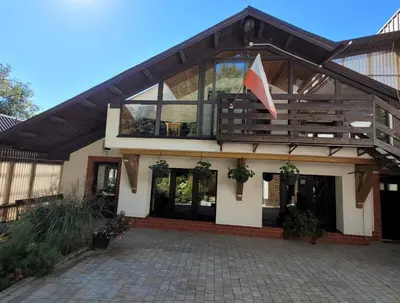 a house with a flag on the front of it at Atrium Jerzmanowice in Jerzmanowice