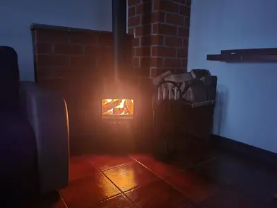 a brick fireplace with a light in a room at Atrium Jerzmanowice in Jerzmanowice