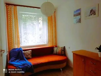 a kitchen with white cabinets and a stove at Słoneczny Pokój w bloku na 1 p dla 1 Niepalącej Osoby od 1 do 12 miesięcy in Kraków