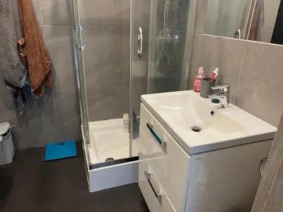 a bathroom with a shower and a sink and a shower at Borkowska Corner in Kraków