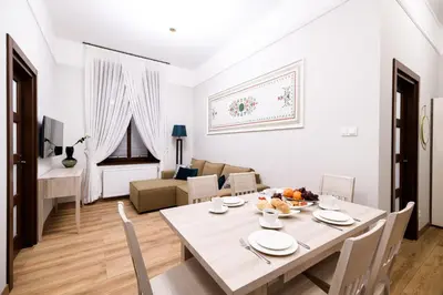a bedroom with a wooden cabinet next to a bed at Family AC apartment Old Town Main Railway Station in Kraków