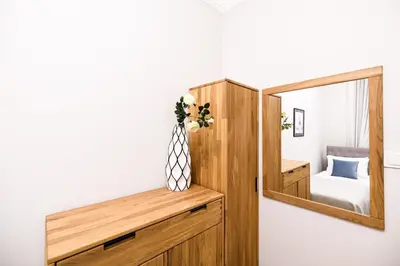 a bathroom with a white toilet in a stall at Family AC apartment Old Town Main Railway Station in Kraków