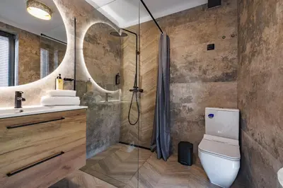 a bathroom with a shower and a toilet and a sink at Piotrowiczówka Osada w Szczyrzycu in Szczyrzyc