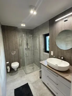 a bathroom with a sink and a shower and a toilet at Villa Kryspinów K&J in Kryspinów