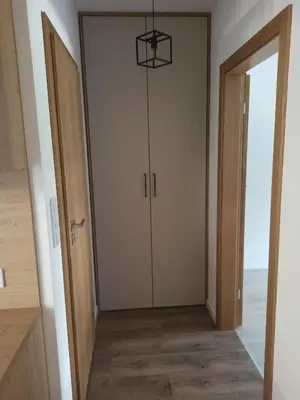 a hallway with a door with a basketball hoop hanging from it at Centrum Konferencyjno-Noclegowe in Iwkowa