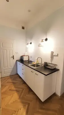 a kitchen with a sink and a counter top at Floriańska 10 C-D by Homeprime in Kraków