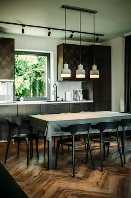 a kitchen with a large dining table and chairs at Jurajski Zakątek in Skała